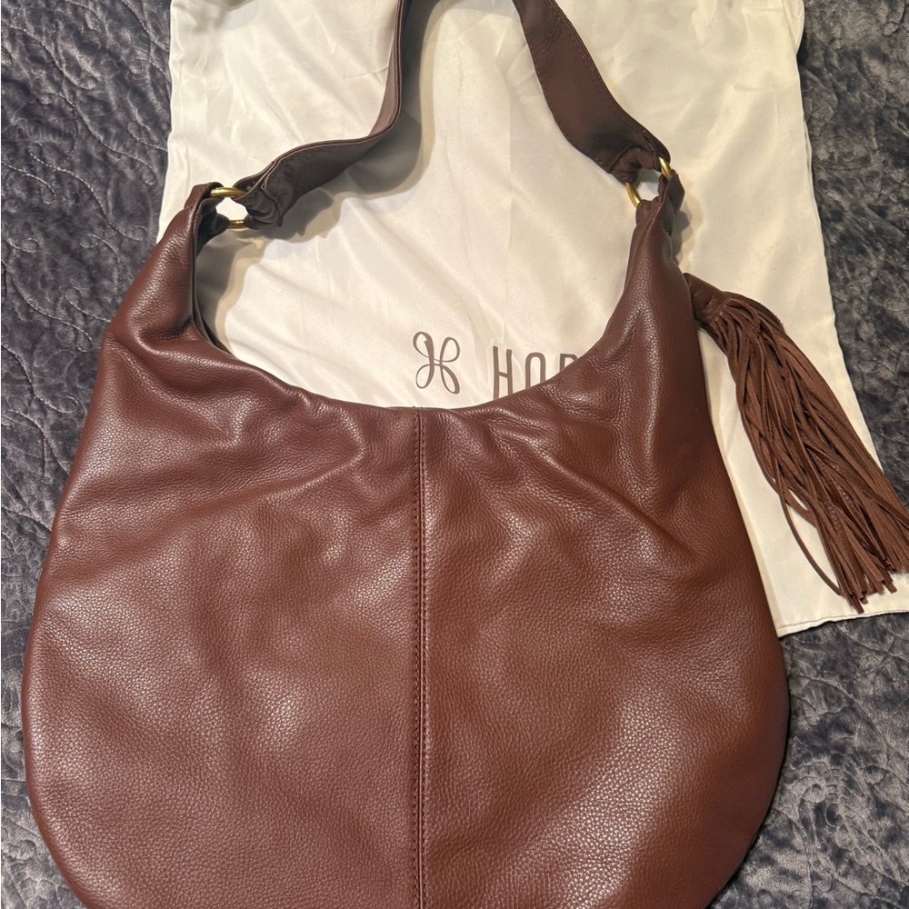 HOBO Brown Leather Hobo Bag with Tassel Accent. New with dust bag. NWOT